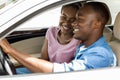 Loving black man and woman sitting inside new auto Royalty Free Stock Photo