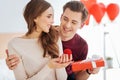 Loving boyfriend surprising his girlfriend with proposal Royalty Free Stock Photo