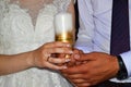 The bride and groom hold a candle in their hands family hearth, wedding tradition Royalty Free Stock Photo