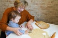 Loving caring grandmother, beautiful senior woman, baking tasty