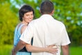 Loving Caucasian Couple Having Time Together Embraced Outdoors in Summer Park