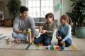 Playful dad playing with little kids at home Royalty Free Stock Photo