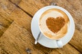 Loving coffee. Cup of fresh cappuccino with heart sign