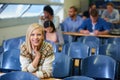 Loving college life. Portrait of a smiling college student sitting in a lecture hall.