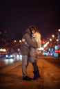 Loving couple on a background of the night winter city Royalty Free Stock Photo