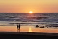 Loving couple in the beach watching sunset Royalty Free Stock Photo