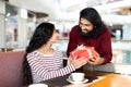 Loving couple celebrating birthday or anniversary at coffee shop Royalty Free Stock Photo