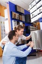 Loving couple choosing mailbox in hardware store Royalty Free Stock Photo