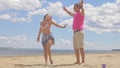 Loving couple on the coast, dancing. This is their love story. They hug and kiss. A man and a woman are happy and joyful Royalty Free Stock Photo