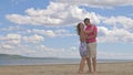 Loving couple on the coast, dancing. This is their love story. They hug and kiss. A man and a woman are happy and joyful Royalty Free Stock Photo