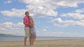 Loving couple on the coast, dancing. This is their love story. They hug and kiss. A man and a woman are happy and joyful Royalty Free Stock Photo