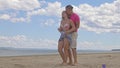 Loving couple on the coast, dancing. This is their love story. They hug and kiss. A man and a woman are happy and joyful Royalty Free Stock Photo