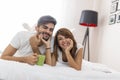 Couple drinking morning coffee in bed Royalty Free Stock Photo