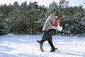 Loving couple dancing in winter forest. Walk on frosty clear day Royalty Free Stock Photo