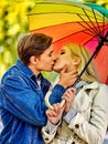 Loving couple on a date kissing under umbrella Royalty Free Stock Photo