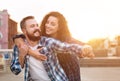 Loving couple dating at sunset in city, having fun Royalty Free Stock Photo