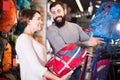 Loving couple deciding on new rucksack Royalty Free Stock Photo