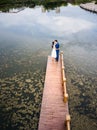 Loving couple on the dock at the lake Royalty Free Stock Photo