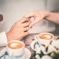 Loving couple drink coffee after the wedding. Hands newlyweds