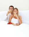 Loving couple drinking Champagne with strawberries Royalty Free Stock Photo
