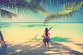 A loving couple enjoying the breathtaking views of the tropical sandy beach Royalty Free Stock Photo