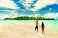 A loving couple enjoying the breathtaking views of the tropical sandy beach Royalty Free Stock Photo