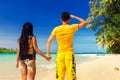 A loving couple enjoying the breathtaking views of the tropical sandy beach Royalty Free Stock Photo