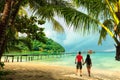 A loving couple enjoying the breathtaking views of the tropical sandy beach Royalty Free Stock Photo