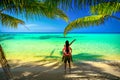 A loving couple enjoying the breathtaking views of the tropical sandy beach Royalty Free Stock Photo