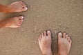 Loving couple feet in the sand Royalty Free Stock Photo
