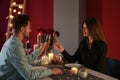 Loving couple with glasses of champagne in restaurant on romantic date Royalty Free Stock Photo