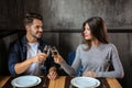 Loving couple with glasses of champagne in restaurant on romantic date Royalty Free Stock Photo