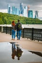 A loving couple going along the embankment of the Moscow river Royalty Free Stock Photo