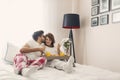 Loving couple having breakfast in bed Royalty Free Stock Photo