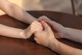 Loving couple holding hands on table in cafe Royalty Free Stock Photo