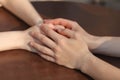 Loving couple holding hands on table in cafe Royalty Free Stock Photo