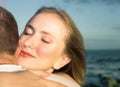 Loving couple hugging with focus on woman's face Royalty Free Stock Photo