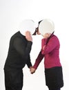 A loving couple kissing each other hidden behind Royalty Free Stock Photo