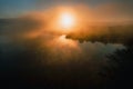 Loving couple kissing on the lake at sunset. Beautiful young couple in love walking on the shore of the lake at sunset in the rays Royalty Free Stock Photo