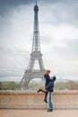 Loving couple kissing near the Eiffel Tower in Paris Royalty Free Stock Photo