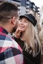 Loving couple kissing outdoor. Cute couple of hipsters is walking in spring park. Beautiful sunny day. Walking on the city`s Royalty Free Stock Photo