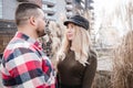 Loving couple stay outdoor. Cute couple of hipsters is walking in spring park. Beautiful sunny day. Walking on the city`s street, Royalty Free Stock Photo