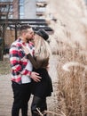 Loving couple kissing outdoor. Cute couple of hipsters is walking in spring park. Beautiful sunny day. Walking on the Royalty Free Stock Photo