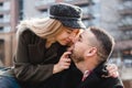 Loving couple kissing outdoor. Cute couple of hipsters is walking in spring park. Beautiful sunny day. Walking on the city`s Royalty Free Stock Photo