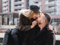 Loving couple kissing outdoor. Cute couple of hipsters is walking in spring park. Beautiful sunny day. Walking on the city`s Royalty Free Stock Photo