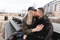 Loving couple kissing outdoor. Cute couple of hipsters is walking in spring park. Beautiful sunny day. Walking on the city`s Royalty Free Stock Photo