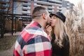 Loving couple kissing outdoor. Cute couple of hipsters is walking in spring park. Beautiful sunny day. Walking on the city`s Royalty Free Stock Photo