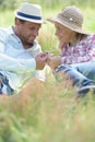 loving couple layed in long grass Royalty Free Stock Photo
