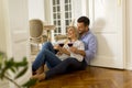 Loving couple looking at each other while drinking red wine on f Royalty Free Stock Photo