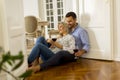 Loving couple looking at each other while drinking red wine on f Royalty Free Stock Photo